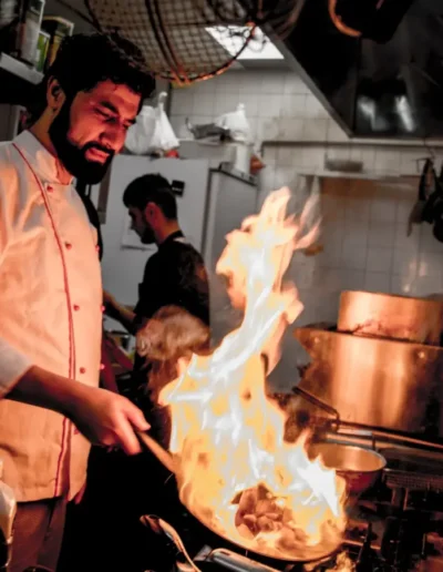 Head chef and owner Rowan flambéing in the kitchen of Italian Restaurant San Mario's in Zeewolde